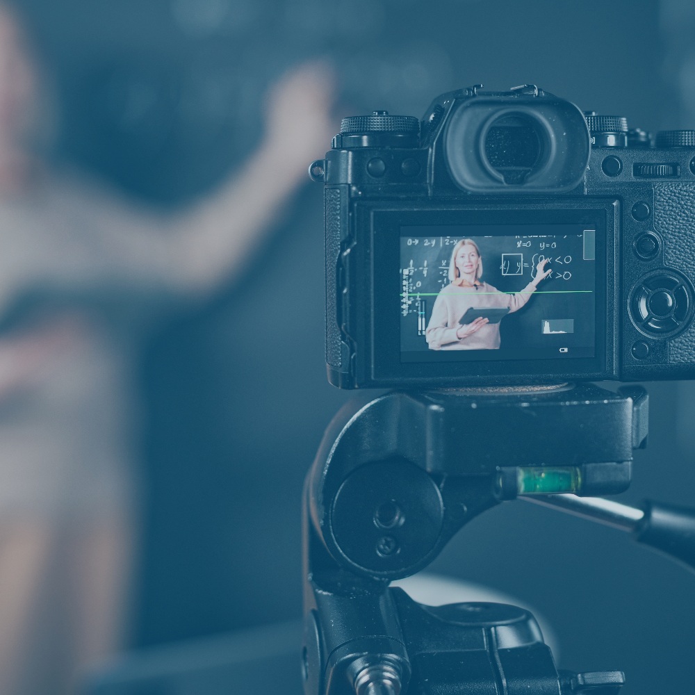 Photo of camera recording someone giving a lecture