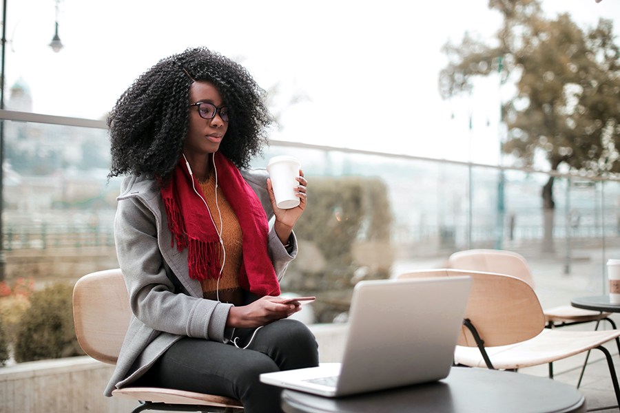 staff member sitting outside with her laptop